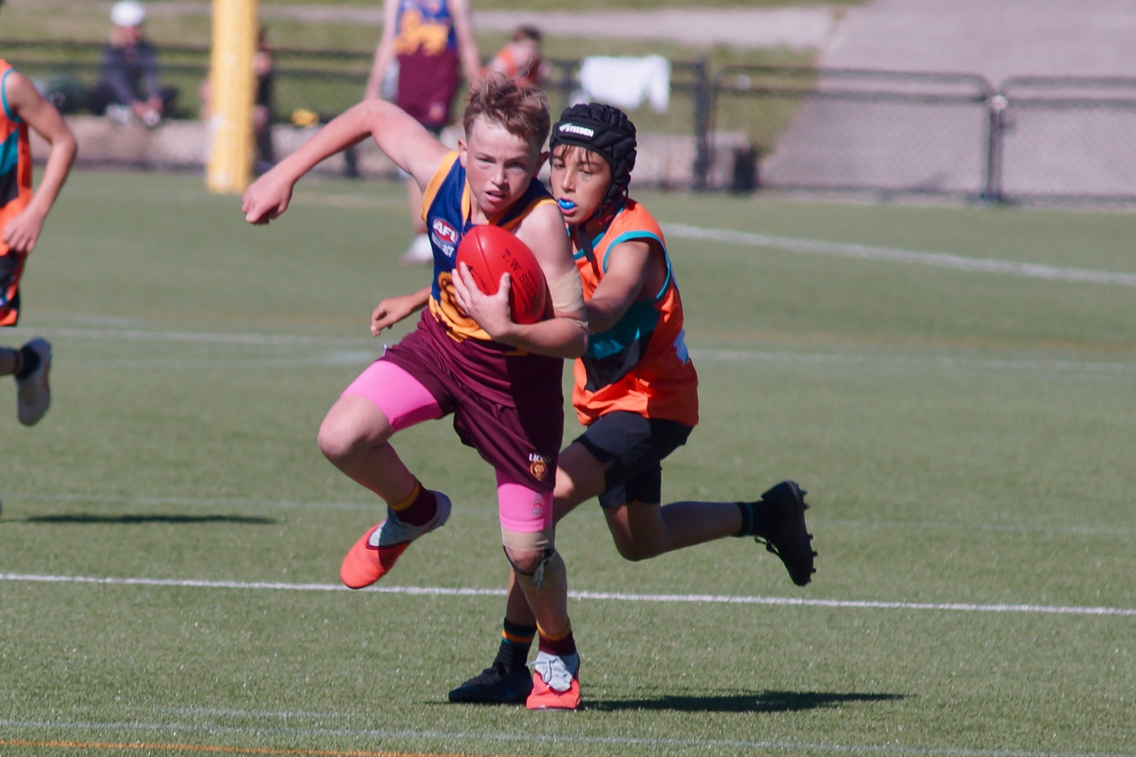 Junior boys breaking a tackle